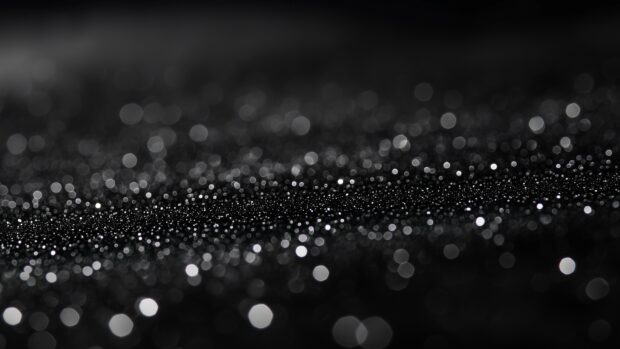 Deep black glitter 4K wallpaper with a smooth, glossy shine.