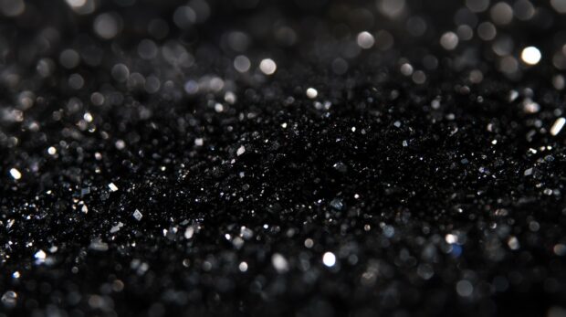 Deep black glitter wallpaper HD with intense sparkle.