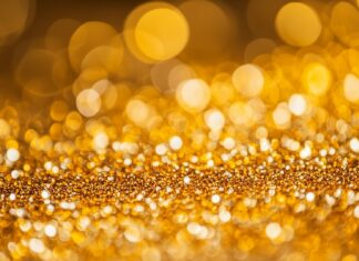 Glitter background HD in golden hues with a dazzling effect.