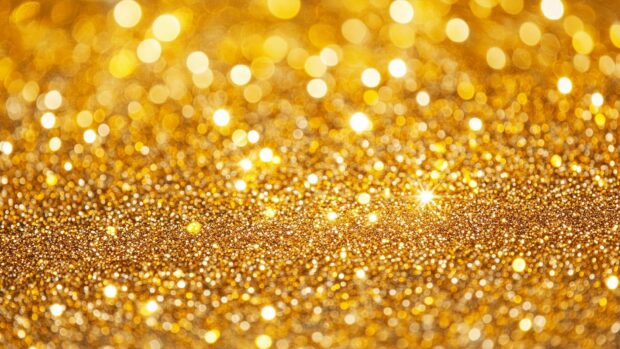 Golden glitter HD background with a radiant.