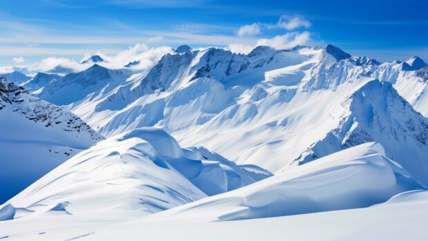 Majestic winter 4K wallpaper with mountains covered in fresh snow.