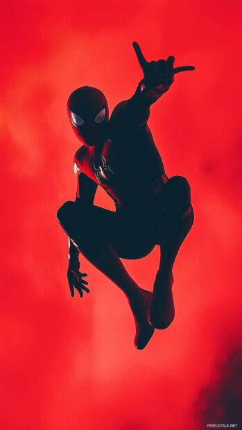 Phone wallpaper of Spiderman against a bright red background.