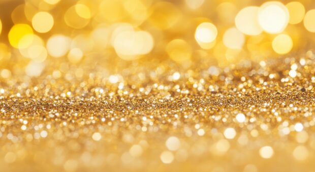 Rich golden glitter wallpaper with a luxurious texture.