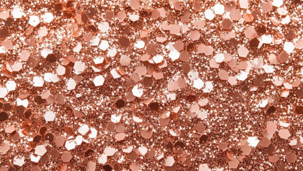 Rose gold glitter wallpaper with a warm, inviting shimmer.