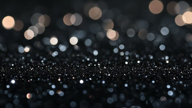 Sparkling black glitter 4K background with deep shimmer.