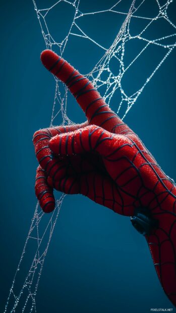 Spiderman hand shooting a web against a dark blue background.