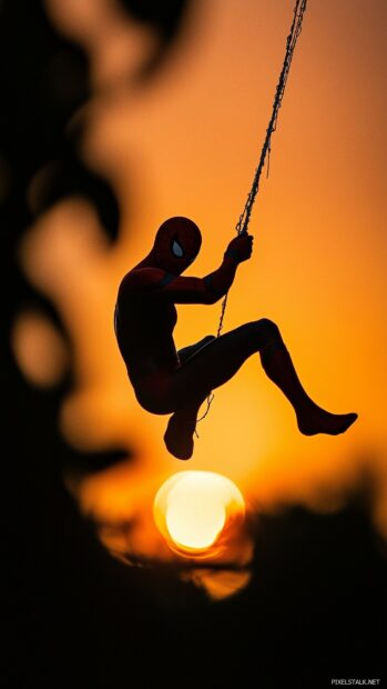 Spiderman silhouette swinging on a web with a sunset background, Black iPhone wallpaper.