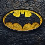 The classic Batman logo 4K in bright yellow and black.