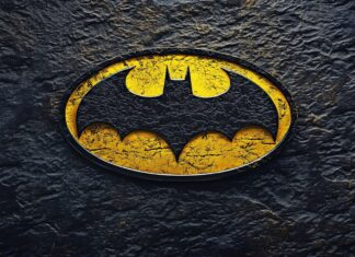 The classic Batman logo 4K in bright yellow and black.