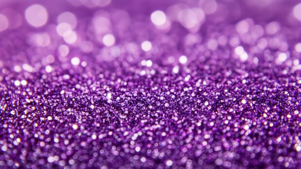 Vibrant purple glitter background with a vivid.