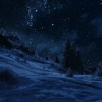 Winter night with stars shining above a snowy landscape.