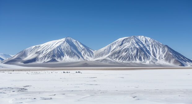 Winter wonderland with snow covered mountains and a clear blue sky, HD Wallpaper.