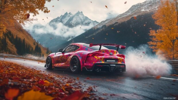 1080p car background with a brightly colored Toyota Supra in mid drift on a mountain road.