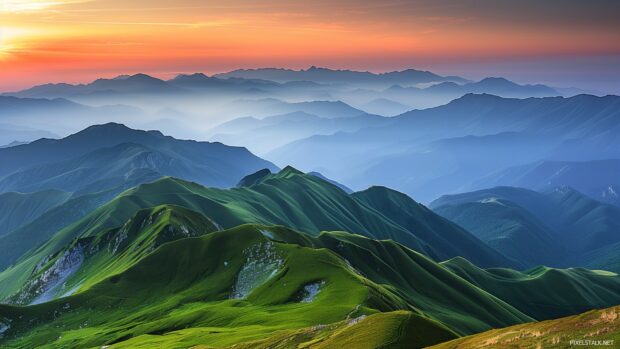 1920×1080 HD Wallpaper with majestic mountain range at sunrise.