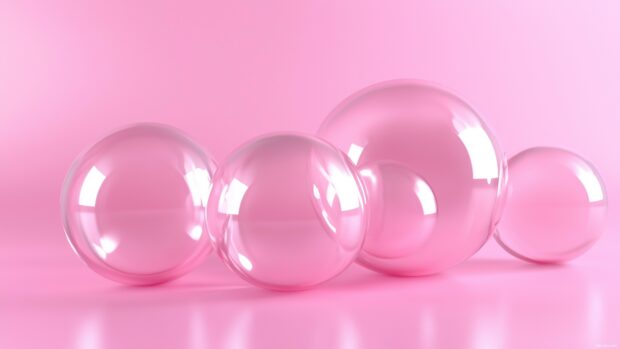 3D Desktop Wallpaper with a set of floating pink 3D orbs softly clustered together.