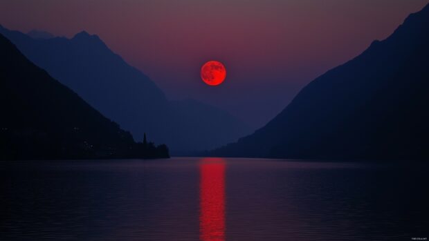 A Blood Moon rising above a serene lake, its eerie red light reflecting on the still water with a silhouette of distant mountains in the background.