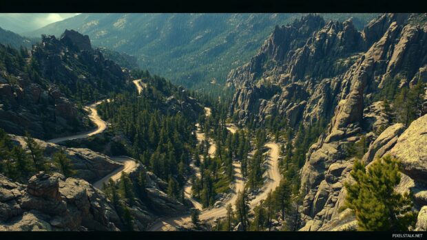 A birds eye view of the Rocky Mountains, showcasing winding trails and rocky outcrops.