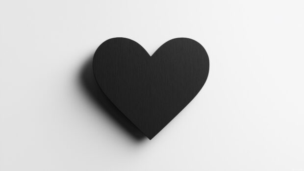 A bold, solid black heart wallpaper.