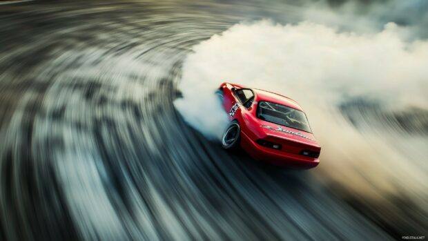 A bright red race car drifting through a sharp corner on a track, with smoke billowing from the tires.