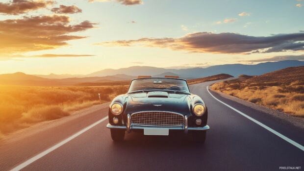 A classic convertible driving through a desert road at sunset, with the car polished body reflecting the fiery colors of the sky.