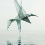 A cool 3D bird in mid flight, formed by geometric shapes and suspended above a calm, reflective water surface.