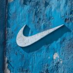 A cool blue Nike wallpaper featuring the iconic swoosh logo in a contrasting white.