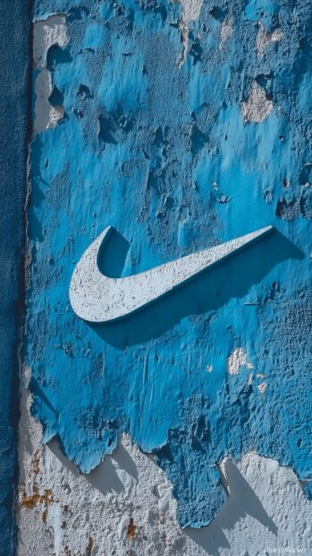 A cool blue Nike wallpaper featuring the iconic swoosh logo in a contrasting white.