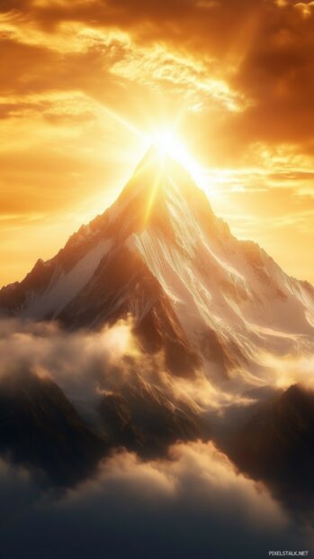 A cool mountain peak surrounded by swirling fog and golden sunlight breaking through.