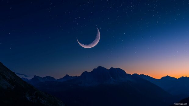 A crescent moon hanging delicately in a crystal clear night sky, surrounded by faint stars.