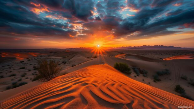 A dramatic desert desktop wallpaper 1920x1080 with sand dunes and a fiery sunset.