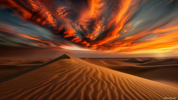 A dramatic desert landscape 1080 desktop background with sand dunes and a fiery sunset.