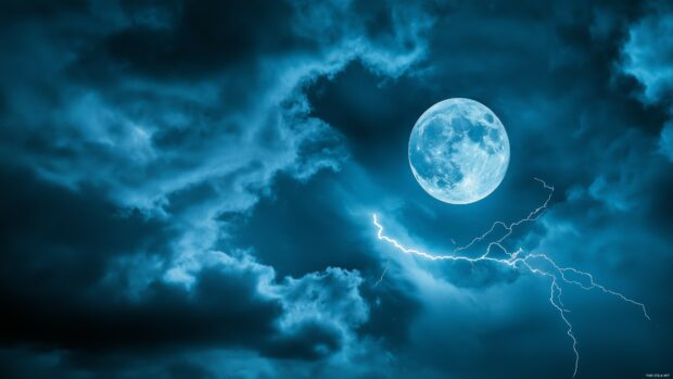 A dramatic view of a full moon breaking through dark storm clouds.