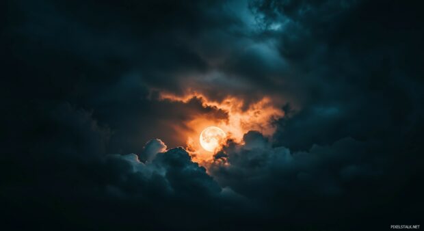 A dramatic view of a full moon breaking through dark storm clouds, with a powerful and awe inspiring atmosphere and flashes of distant lightning.