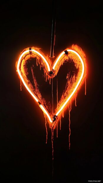 A glowing neon broken heart sign flickering against a black backdrop.