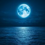 A mesmerizing Blue Moon glowing softly above a tranquil ocean, with its cool blue light reflecting off the water and creating a serene, moonlit seascape.