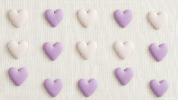 A minimalist pattern of small lavender hearts.