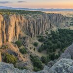 A panoramic view of the Rocky Mountains during sunrise.