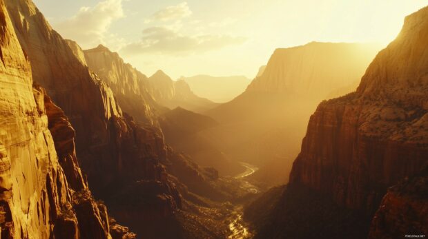 A panoramic view of the Rocky Mountains during sunrise, with golden light hitting jagged cliffs.