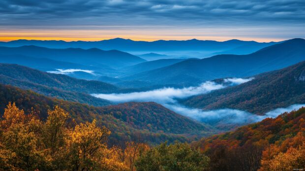 A serene mountain landscape with low lying clouds drifting over emerald green valleys.