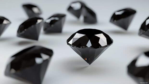 A series of floating black 3D diamonds, arranged in a sleek, geometric pattern.