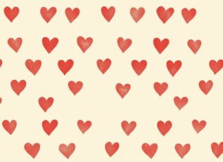 A simple pattern of small, red hearts 4K resolution evenly spaced on a light beige background.