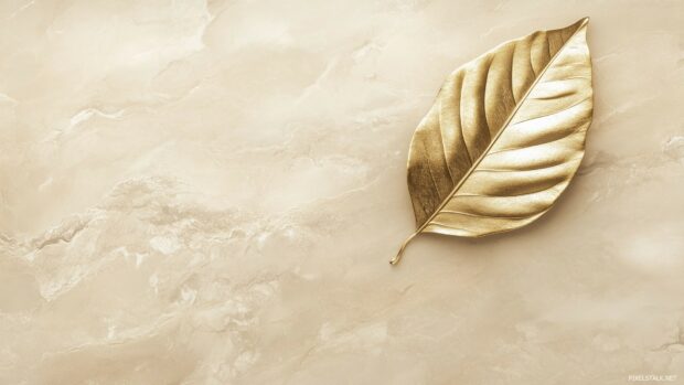 A single golden leaf resting on a soft beige background, minimalist elegance, crisp lines, and subtle shadows.