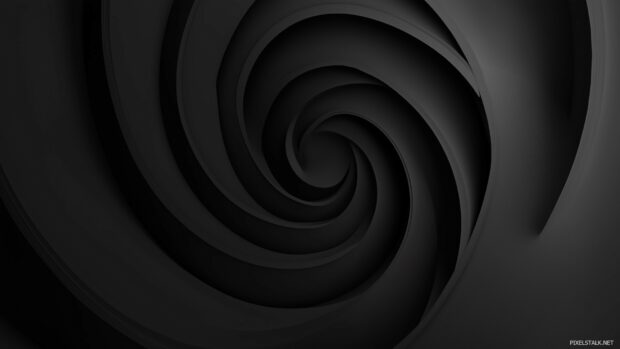 A sleek 3D black spiral gently rotating in a dark.