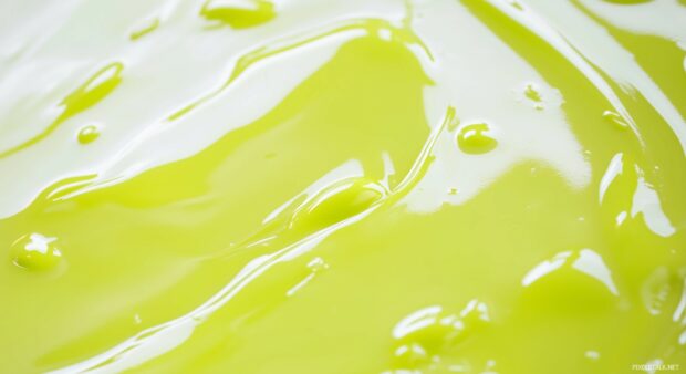 A sleek, glossy lime green background with soft reflections, providing a smooth, modern, and energetic look.