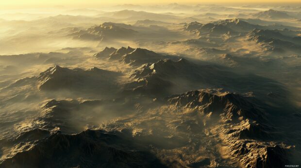 A vast mountain valley surrounded by towering peaks, bathed in soft golden light at sunrise, beautiful landscape.