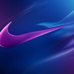 Abstract Nike 4K Wallpaper with a swoosh pattern integrated into a vibrant blue and purple abstract design.