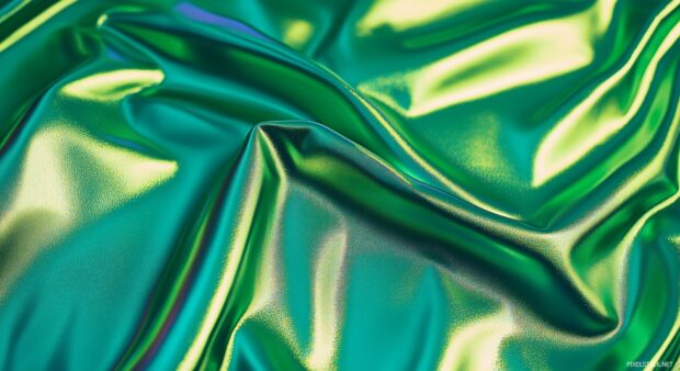 Abstract neon green texture with a shimmering metallic finish, reflecting light in different directions for a high tech and glossy feel.