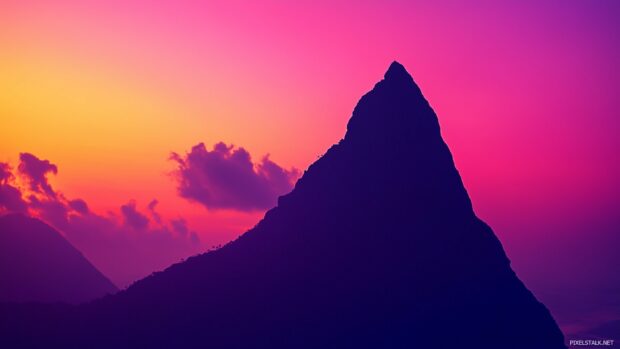 An artistic Mountain silhouette against a vibrant gradient sunset, minimalist and elegant.