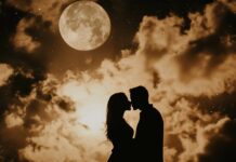 Beautiful Love Desktop Wallpaper with a silhouette of a couple kissing under a full moon