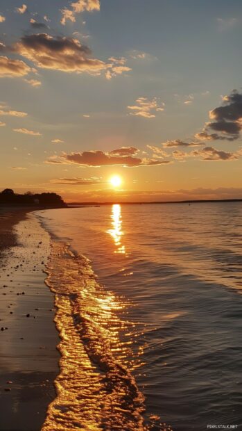 Beach sunset 1080x1920 Wallpapers HD with golden hues reflecting on the water.